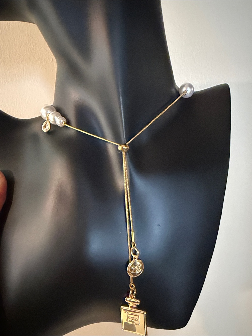 Gold Tone Necklace with White Pearl Accents and ChanelCharm Drop